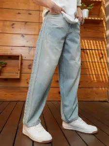 Men wearing classic straight fit jeans. Classic straight fit jeans styled for everyday wear.